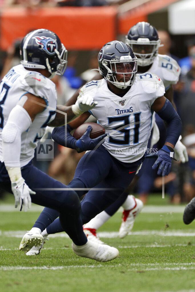 Ron Schwane Tennessee Titans free safety Kevin Byard (31) rushes after intercepting the ball during the second half in an NFL football game against the Cleveland Browns, Sunday, Sept. 8, 2019, in Cleveland. (AP Photo/Ron Schwane)