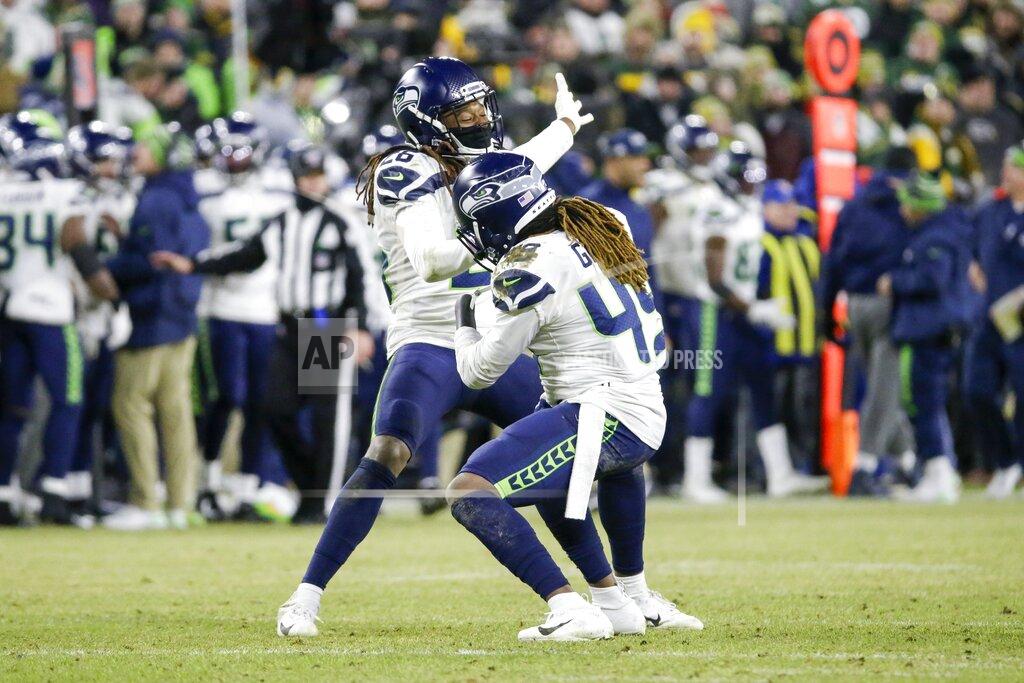 Mike Roemer Seattle Seahawks' Shaquill Griffin and Shaquem Griffin celebrate a sack during the second half of an NFL divisional playoff football game against the Green Bay Packers Sunday, Jan. 12, 2020, in Green Bay, Wis. (AP Photo/Mike Roemer)