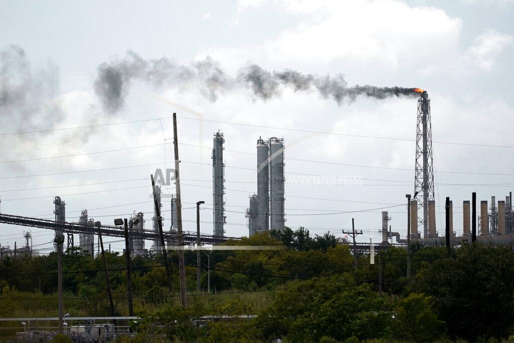 Eric Gay Winds blow the smoke from a refinery, Wednesday, Aug. 26, 2020, in Port Arthur, Texas. The energy industry is bracing for catastrophic storm surges and winds as Hurricane Laura cuts a dangerous path toward the coastlines of Texas and Louisiana.(AP Photo/Eric Gay)