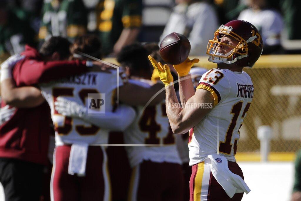 Aaron Gash Washington Football Team's Adam Humphries warms up before an NFL football game against the Green Bay Packers Sunday, Oct. 24, 2021, in Green Bay, Wis. (AP Photo/Aaron Gash)