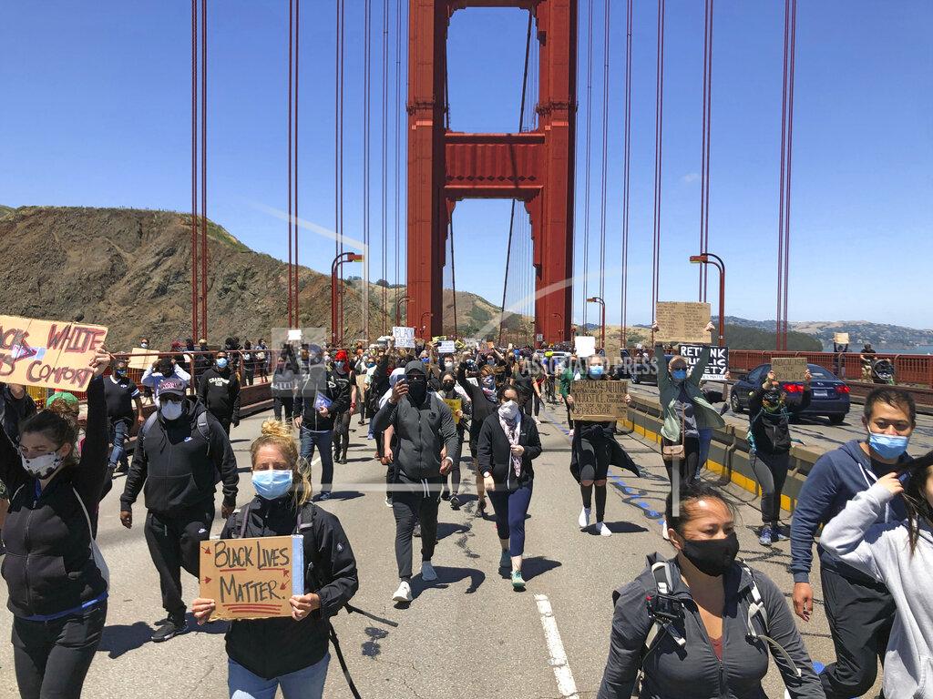 Jeff Chiu Dozens of people march across the Golden Gate Bridge in support of the Black Lives Matter movement in San Francisco Saturday, June 6, 2020. People are protesting the death of George Floyd, who died after he was restrained by Minneapolis police on May 25 in Minnesota. (AP Photo/Jeff Chiu)