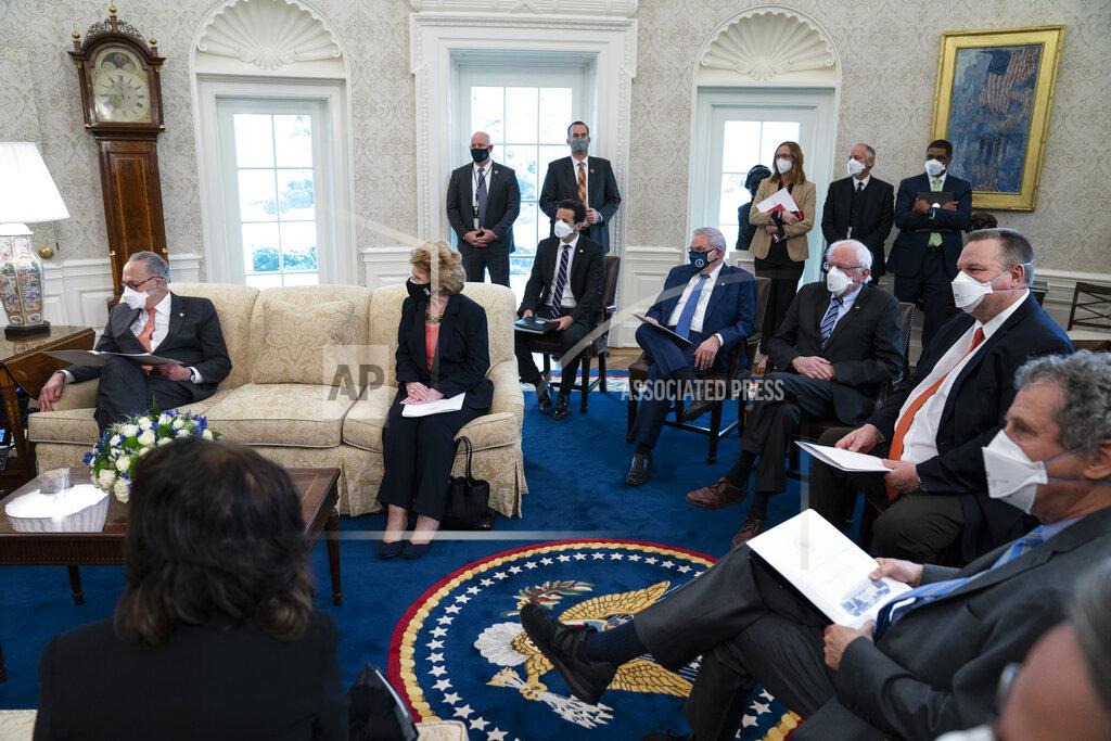 Evan Vucci Senate Majority Leader Sen. Chuck Schumer of N.Y., left, and Democratic lawmakers fill the Oval Office of the White House to discuss a coronavirus relief package with President Joe Biden, Wednesday, Feb. 3, 2021, in Washington. (AP Photo/Evan Vucci)