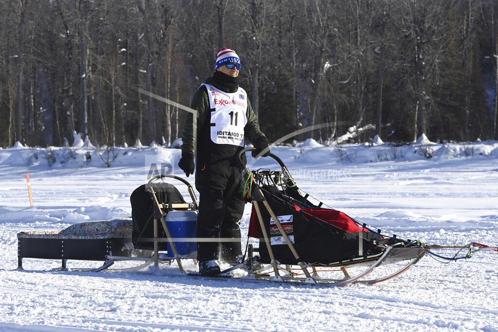Gunnar Johnson travels down the Susitna River during the start of the Iditarod Trail Sled Dog Race on Sunday, March 7, 2021. (Bill Roth/Anchorage Daily News via AP)