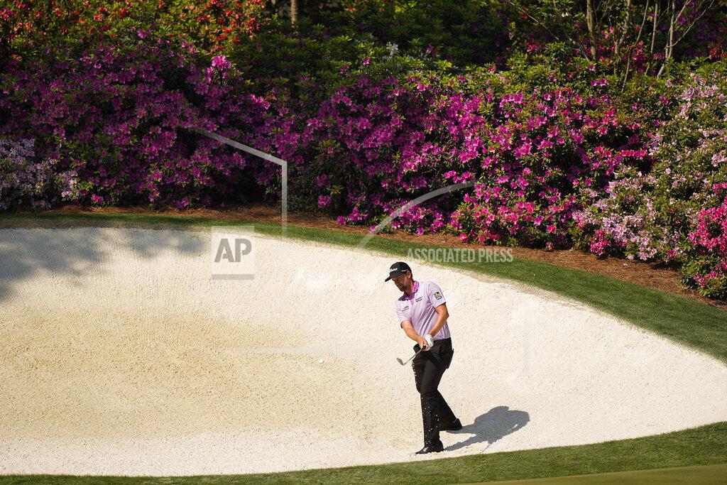 David J. Phillip Webb Simpson hits out of a bunker at the 13th hole during a practice round for the Masters golf tournament on Wednesday, April 7, 2021, in Augusta, Ga. (AP Photo/David J. Phillip)