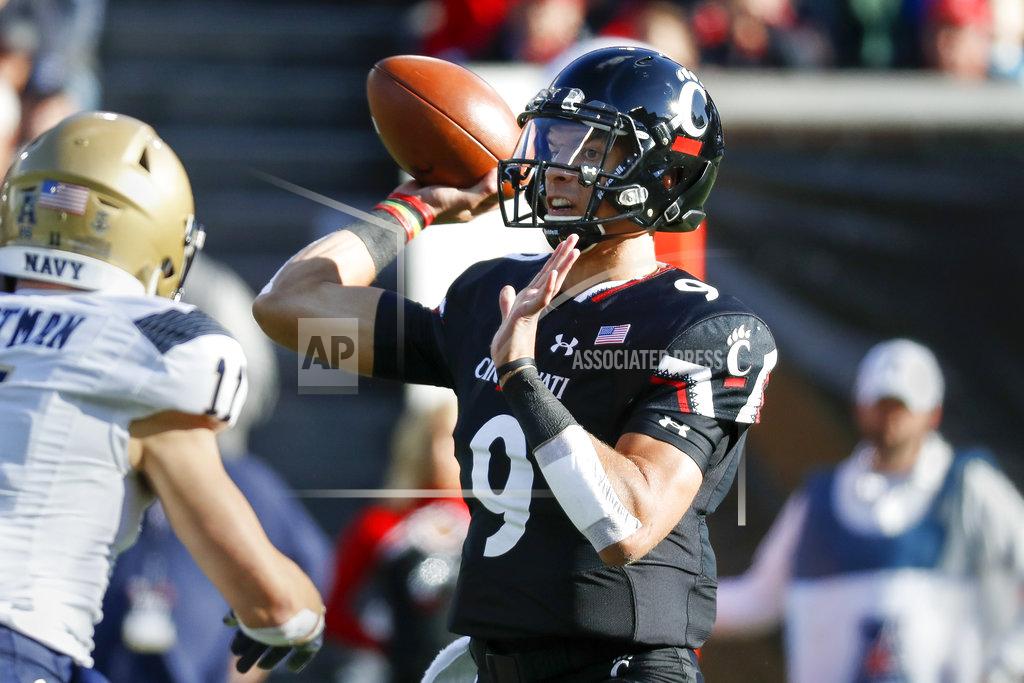John Minchillo Cincinnati quarterback Desmond Ridder (9) passes in the first half of an NCAA college football game against Navy, Saturday, Nov. 3, 2018, in Cincinnati. (AP Photo/John Minchillo)