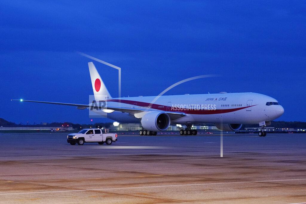 Manuel Balce Ceneta The plane with Japanese Prime Minister Yoshihide Suga aboard, arrives at Andrews Air Force Base, Md., Thursday, April 15, 2021. Suga will be the first foreign leader to have a face-to-face meeting with President Joe Biden, when they meet at the White House on Friday. (AP Photo/Manuel Balce Ceneta)