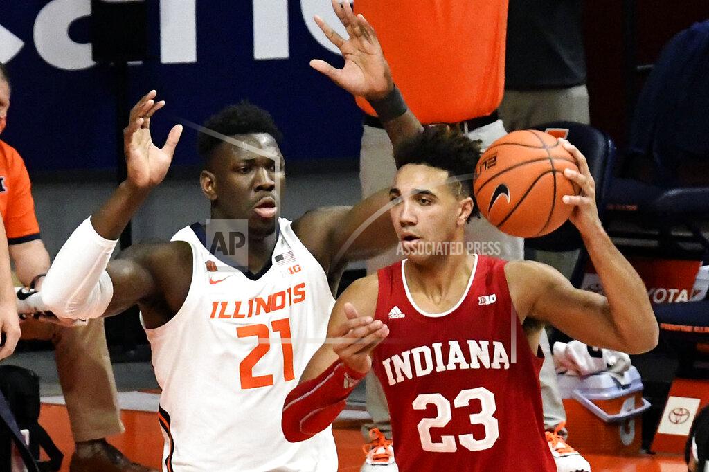 Holly Hart Indiana's forward Trayce Jackson-Davis (23) looks to pass as he is pressured by Illinois center Kofi Cockburn (21) in the first half of an NCAA college basketball game Saturday, Dec. 26, 2020, in Champaign, Ill. (AP Photo/Holly Hart)