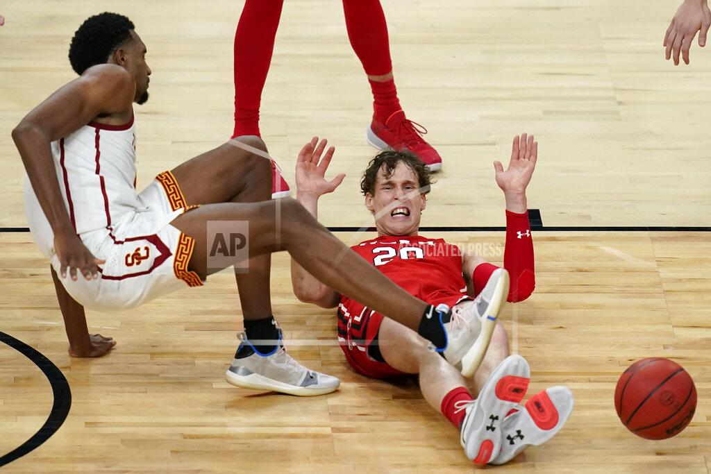 John Locher Utah's Mikael Jantunen, right, fouls Southern California's Evan Mobley, left, during the first overtime of an NCAA college basketball game in the quarterfinal round of the Pac-12 men's tournament Thursday, March 11, 2021, in Las Vegas. (AP Photo/John Locher)