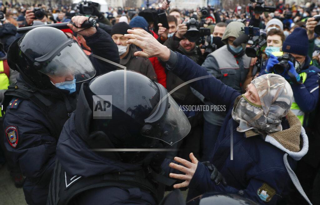 Pavel Golovkin Police detain a man during a protest against the jailing of opposition leader Alexei Navalny in Moscow, Russia, Saturday, Jan. 23, 2021. Russian police on Saturday arrested hundreds of protesters who took to the streets in temperatures as low as minus-50 C (minus-58 F) to demand the release of Alexei Navalny, the country's top opposition figure. (AP Photo/Pavel Golovkin)