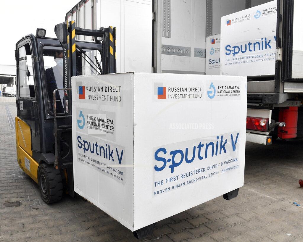 Zoltan Mathe Boxes of Sputnik V vaccines are unloaded from a truck at a warehouse of Hungaropharma, a Hungarian pharmaceutical wholesale company, in Budapest, Hungary, Thursday, March 4, 2021. (Zoltan Mathe/MTI via AP)