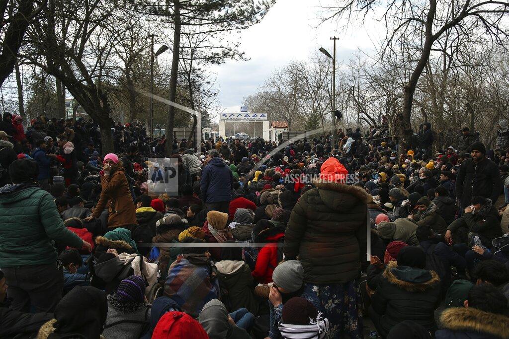 Emrah Gurel FILE - In this Saturday, Feb. 29, 2020 file photo, migrants gather between the Pazarkule border gate, Edirne, Turkey, and the Kastanies border gate, Evros, as they try to enter Greece. Five years on, the deal between European Union and Turkey is no longer working but at a summit next week EU leaders will discuss ways to improve relations with Turkey and could try to revive the agreement. (AP Photo/Emrah Gurel, File)