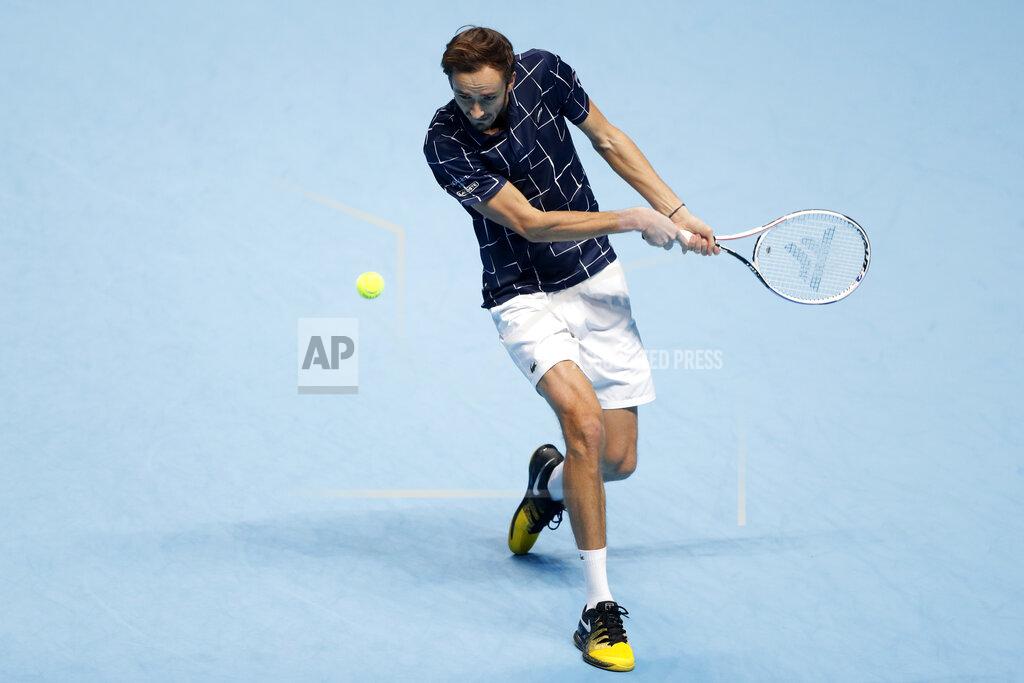 Frank Augstein Daniil Medvedev of Russia returns the ball to Rafael Nadal of Spain during their semifinal match at the ATP World Finals tennis tournament at the O2 arena in London, Saturday, Nov. 21, 2020. (AP Photo/Frank Augstein)