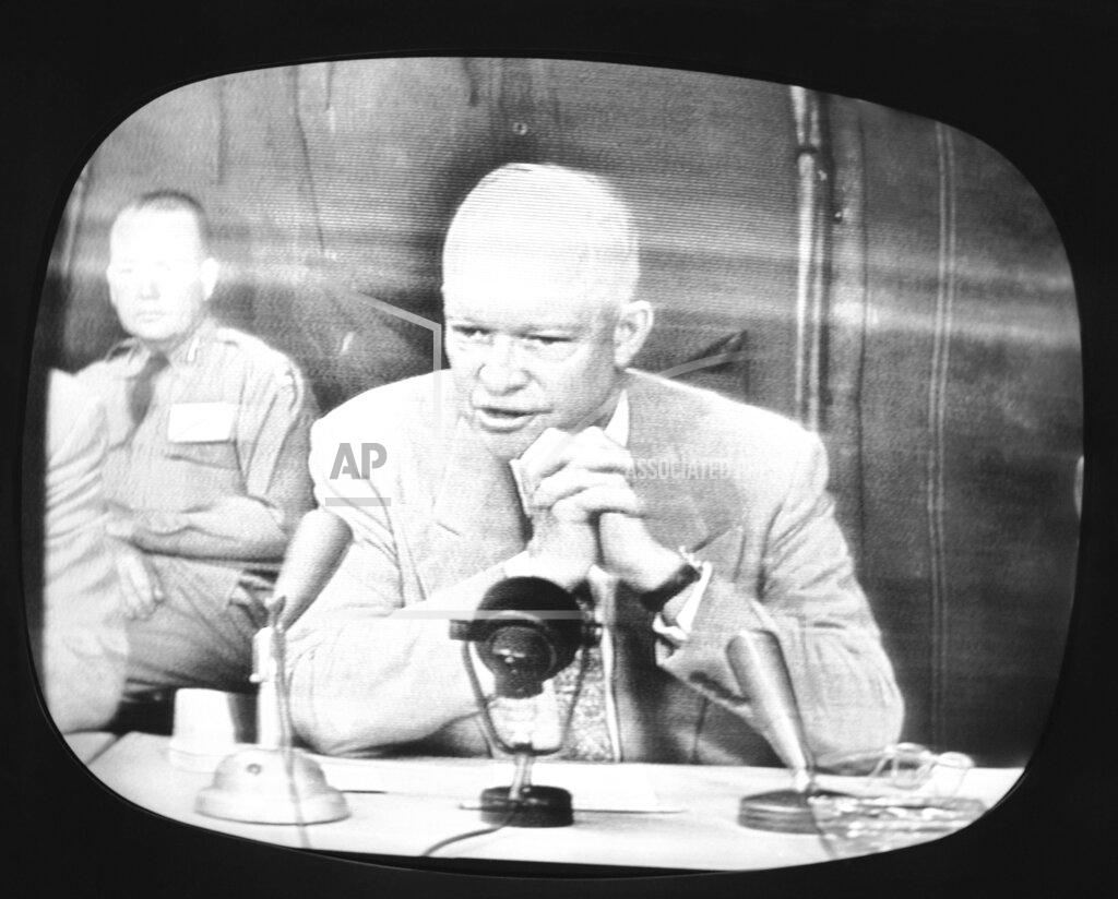 Uncredited FILE - In this June 15, 1955, file photo, President Dwight D. Eisenhower, shown on an NBC Television monitor television receiver in New York reports to the nation on progress of the nationwide 'Operation Alert,' when the nation went underground during the simulated H-Bomb attack on June 15. (AP Photo, File)
