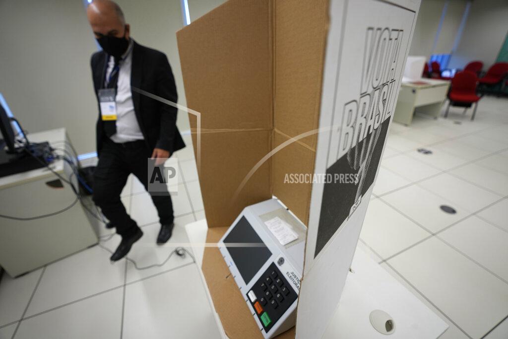 Eraldo Peres A voting machine sits in a presentation room at the headquarters of the Supreme Electoral Court as analysts test the electronic voting system in Brasilia, Brazil, Friday, May 13, 2022. The testing of the voting system is being watched closely this year as President Jair Bolsonaro casts doubts on the system’s integrity and calls for greater involvement of the armed forces in ensuring reliable results for October's general elections. (AP Photo/Eraldo Peres)