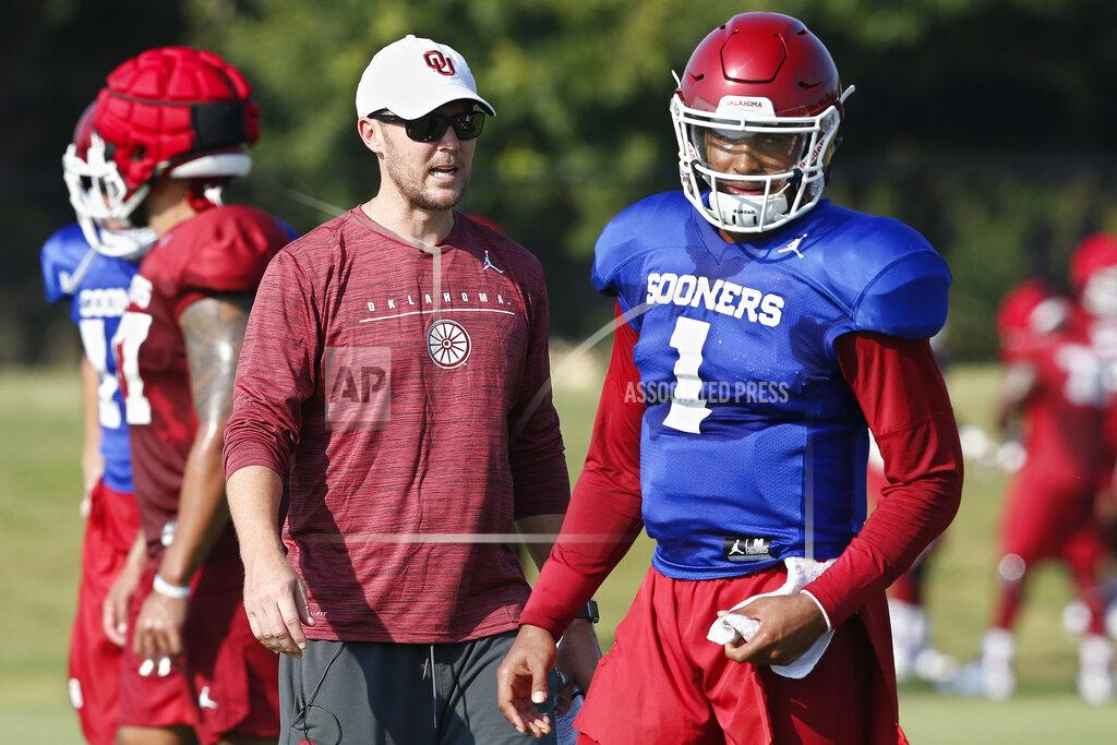 Sue Ogrocki FILE - In this Monday, Aug. 5, 2019, file photo, Oklahoma head coach Lincoln Riley watches quarterback Jalen Hurts (1) during the NCAA college football team's practice in Norman, Okla. Riley has chosen Hurts as his starting quarterback for the Sept. 1 season opener against Houston over Spencer Rattler and Tanner Mordecai. (AP Photo/Sue Ogrocki, File)
