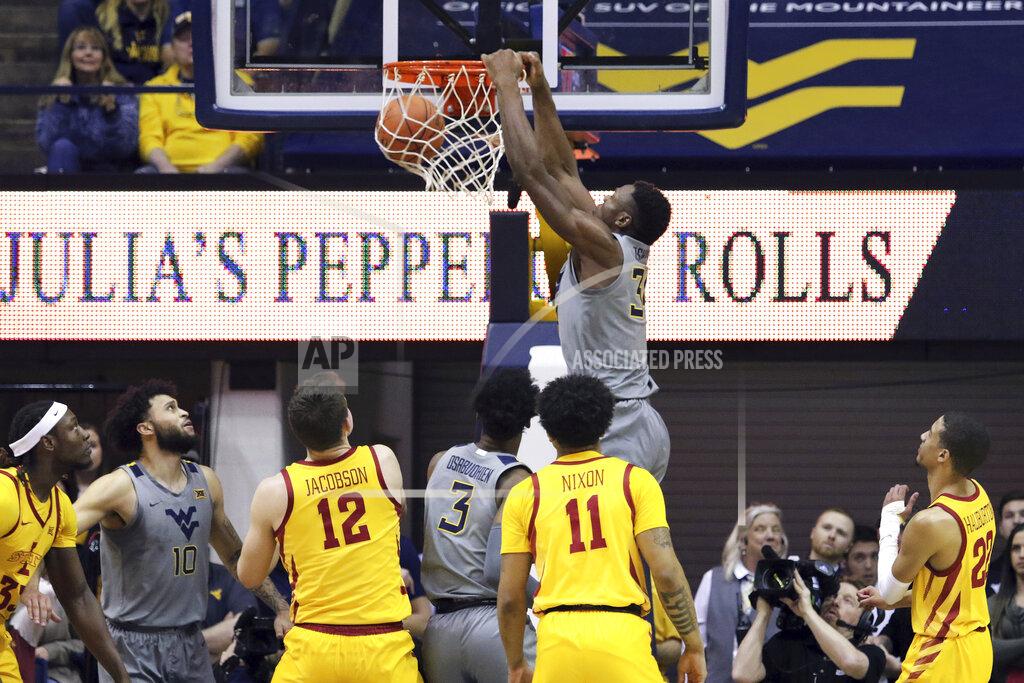 Kathleen Batten West Virginia forward Oscar Tshiebwe (34) dunks the ball during the first half of an NCAA college basketball game against Iowa State Wednesday, Feb. 5, 2020, in Morgantown, W.Va. (AP Photo/Kathleen Batten)