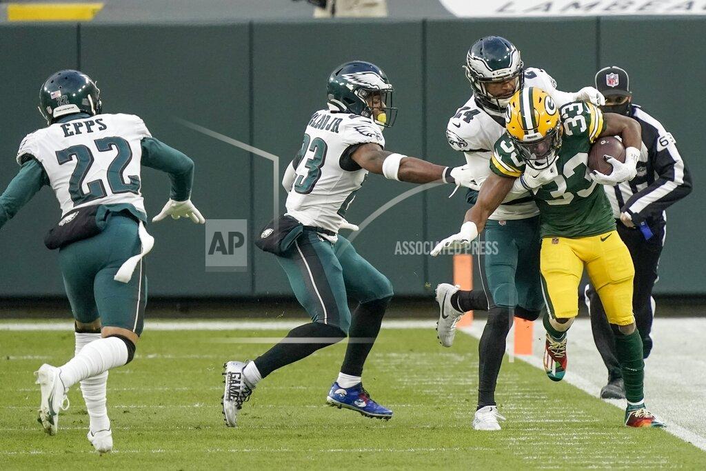 Morry Gash Green Bay Packers' Aaron Jones is run out of bounds during the first half of an NFL football game against the Philadelphia Eagles Sunday, Dec. 6, 2020, in Green Bay, Wis. (AP Photo/Morry Gash)
