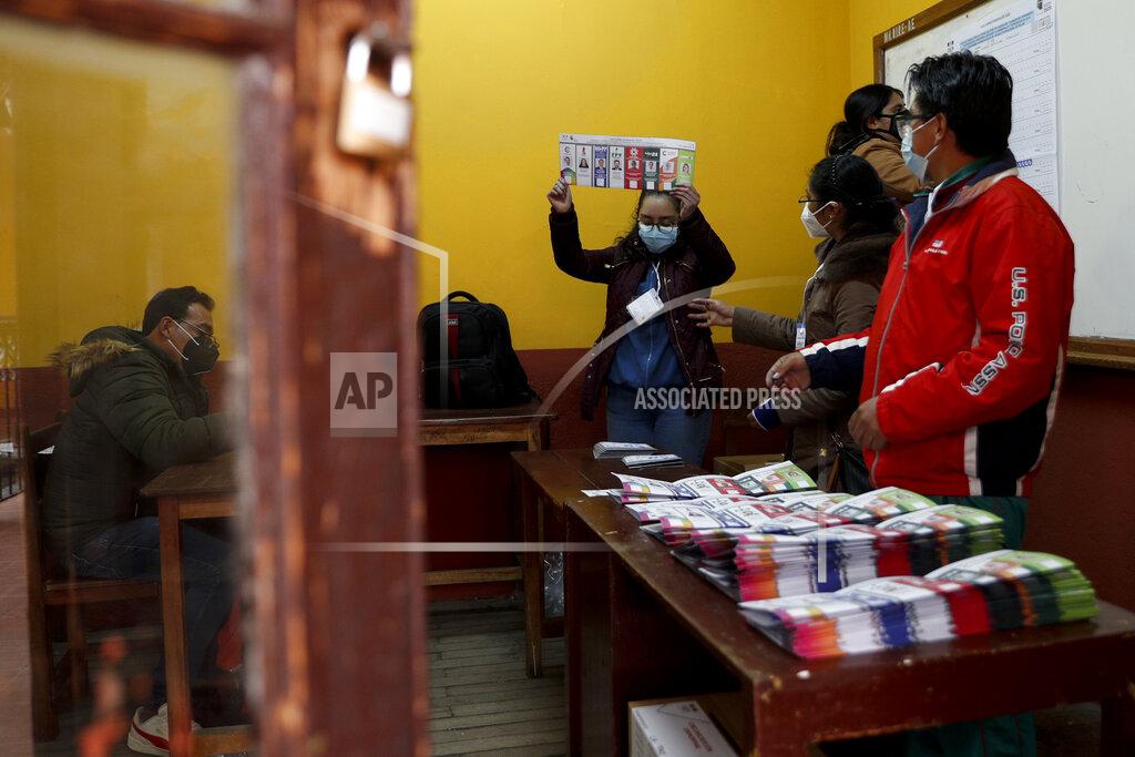 Juan Karita Electoral officials count ballots after polls closed for presidential elections in La Paz, Bolivia, Sunday, Oct. 18, 2020. (AP Photo/Juan Karita)