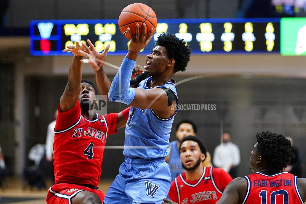 Matt Slocum Villanova's Brandon Slater (3) goes up for a shot against St. John's Greg Williams Jr. (4) during the first half of an NCAA college basketball game, Tuesday, Feb. 23, 2021, in Villanova, Pa. (AP Photo/Matt Slocum)