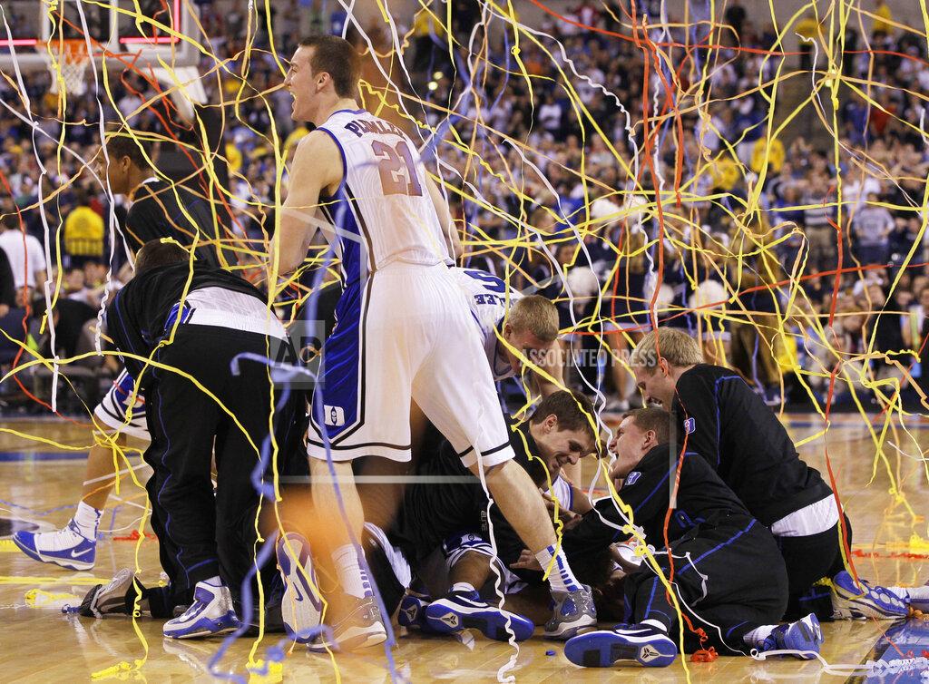 Charlie Neibergall FILE - In this April 5, 2010, file photo, Duke's Miles Plumlee (21) and teammates celebrate after Duke's 61-59 win over Butler in the men's NCAA Final Four college basketball championship game in Indianapolis. (AP Photo/Charlie Neibergall, File)