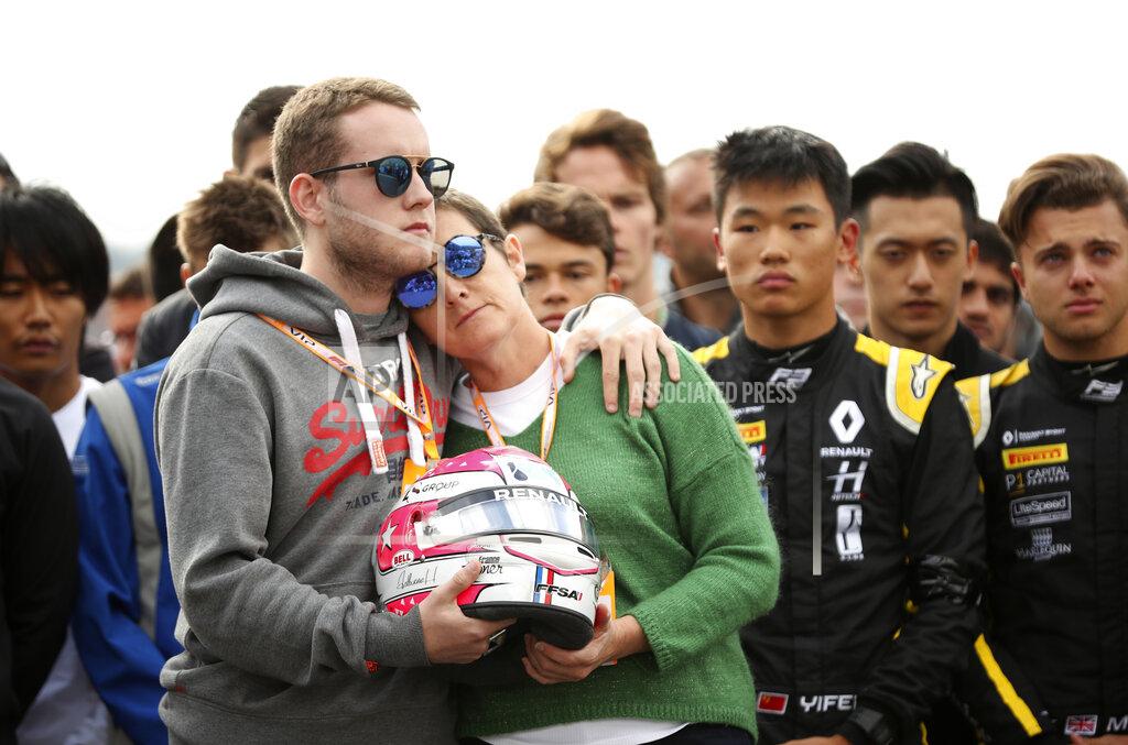 Francisco Seco The mother and brother of Anthoine Hubert hold the helmet of Anthoine Hubert during a moment of silence at the Belgian Formula One Grand Prix circuit in Spa-Francorchamps, Belgium, Sunday, Sept. 1, 2019. The 22-year-old Hubert died following an estimated 160 mph (257 kph) collision on Lap 2 at the high-speed Spa-Francorchamps track, which earlier Saturday saw qualifying for Sunday's Formula One race. (AP Photo/Francisco Seco)