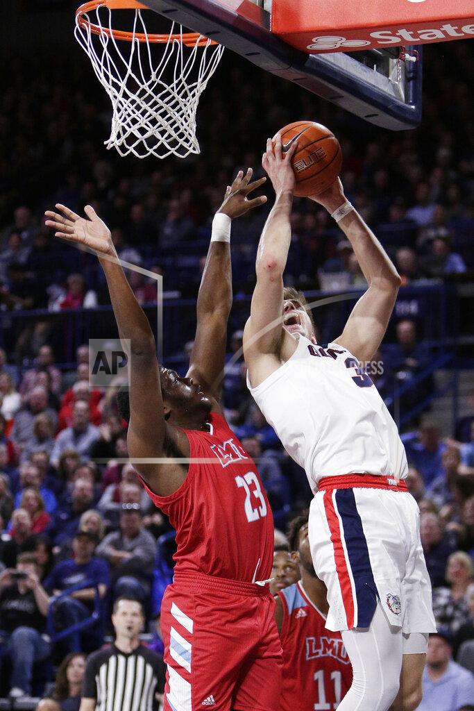 Young Kwak Gonzaga forward Filip Petrusev, right, shoots and is fouled by Loyola Marymount forward Jordan Bell during the first half of an NCAA college basketball game in Spokane, Wash., Thursday, Feb. 6, 2020. (AP Photo/Young Kwak)