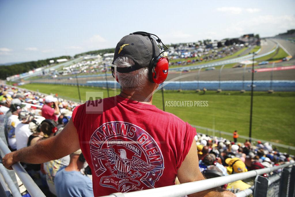 John Munson Fans watch from Turn 1 during a NASCAR Cup Series auto race at Watkins Glen International, Sunday, Aug. 4, 2019, in Watkins Glen, N.Y. (AP Photo/John Munson)
