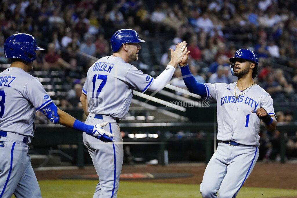Ross D. Franklin Kansas City Royals' MJ Melendez (1) celebrates with Hunter Dozier (17) and Nicky Lopez, left, after Melendez scored against the Arizona Diamondbacks during the sixth inning of a baseball game Tuesday, May 24, 2022, in Phoenix. (AP Photo/Ross D. Franklin)