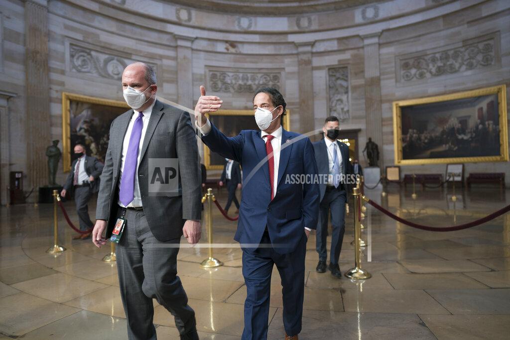 J. Scott Applewhite On the eve of the second impeachment trial of former President Donald Trump, Rep. Jamie Raskin, D-Md., center right, the lead Democratic House impeachment manager, walks through the Rotunda to the Senate to prepare for the case, at the Capitol in Washington, Monday, Feb. 8, 2021. The trial will begin Tuesday with a debate and vote on whether it's even constitutional to prosecute the former president, an argument that could resonate with Republicans keen on voting to acquit Trump. (AP Photo/J. Scott Applewhite)