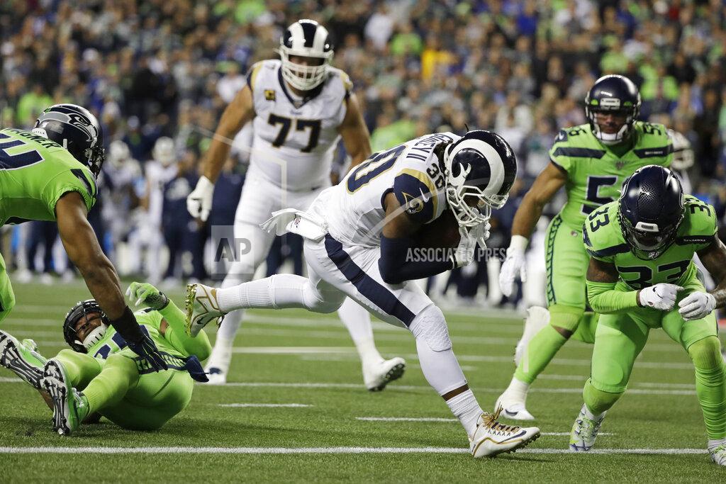 Elaine Thompson Los Angeles Rams running back Todd Gurley, center, rushes for a touchdown against the Seattle Seahawks during the second half of an NFL football game Thursday, Oct. 3, 2019, in Seattle. (AP Photo/Elaine Thompson)