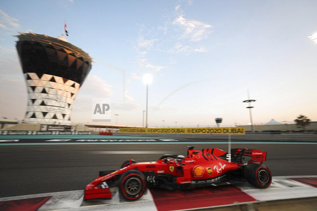 Kamran Jebreili Ferrari driver Sebastian Vettel of Germany steers his car during the qualifying session at the Yas Marina racetrack in Abu Dhabi, United Arab Emirates, Saturday, Nov. 30, 2019. The Emirates Formula One Grand Prix will take place on Sunday. (AP Photo/Kamran Jebreili)