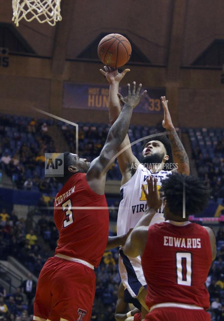 Ray Thompson West Virginia guard Jermaine Haley (10) shoots while defended by Texas Tech forward Deshawn Corprew (3) during the second half of an NCAA college basketball game Wednesday, Jan. 2, 2019, in Morgantown, W.Va. Texas Tech defeated West Virginia 62-59. (AP Photo/Raymond Thompson)