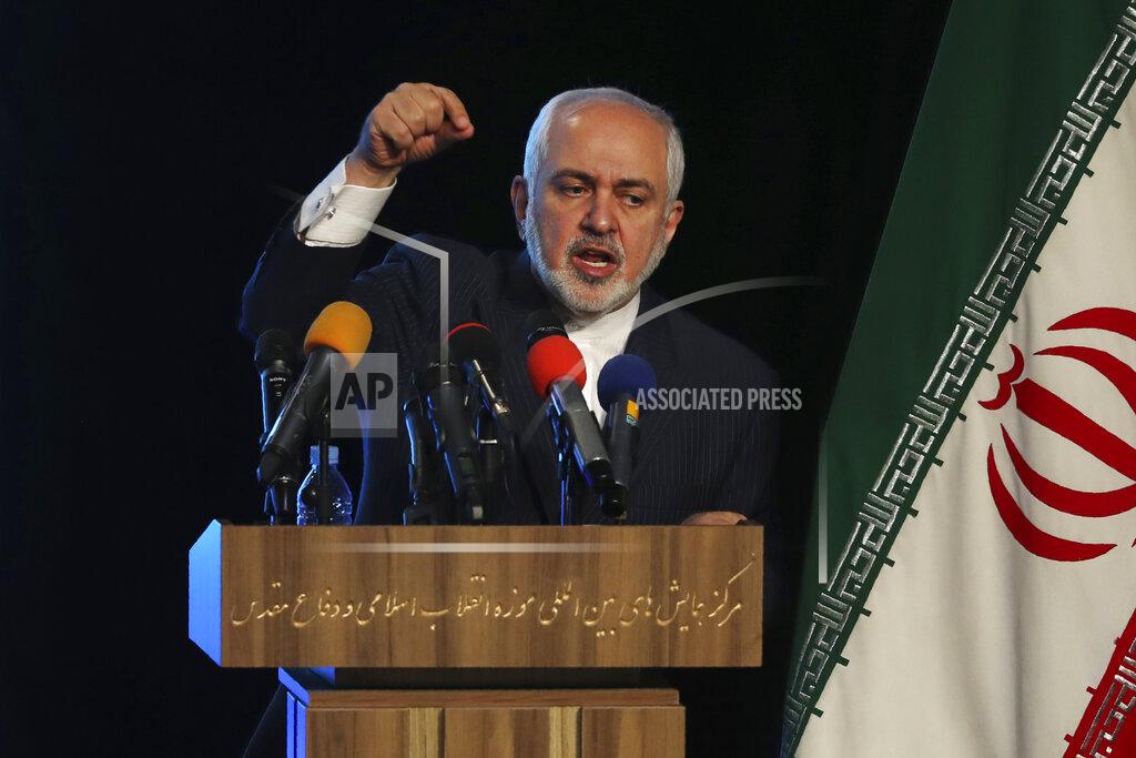 Vahid Salemi Iran's Foreign Minister Mohammad Javad Zarif addresses in a conference in Tehran, Iran, Tuesday, Feb. 23, 2021. Following the conference Zarif told journalists the country has started implementing a law passed by the parliament to curb UN inspections into its nuclear program and would no longer share surveillance footage of its nuclear facilities with the U.N. agency. (AP Photo/Vahid Salemi)