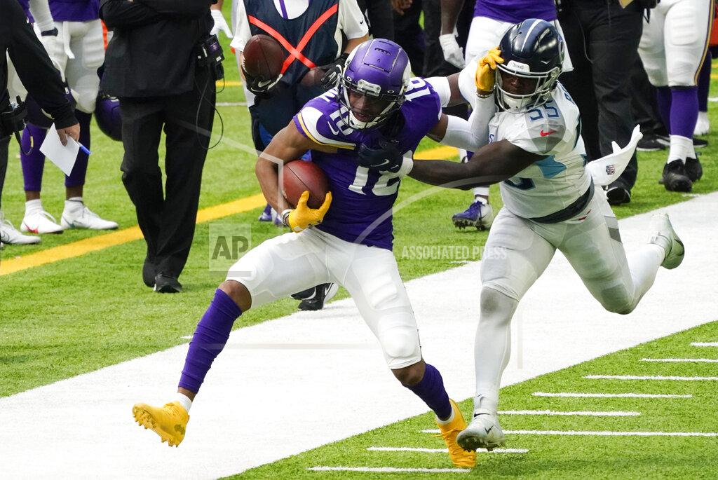 Jim Mone Minnesota Vikings wide receiver Justin Jefferson (18) tries to break a tackle by Tennessee Titans inside linebacker Jayon Brown, right, during the first half of an NFL football game, Sunday, Sept. 27, 2020, in Minneapolis. (AP Photo/Jim Mone)