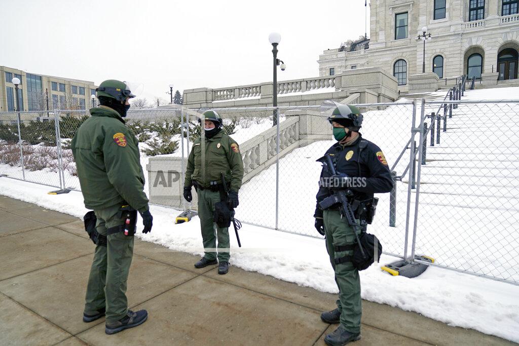 Jim Mone Minnesota Law Enforcement officers protect the Minnesota State Capitol Thursday, Jan. 7, 2021 in St. Paul, Minn., in the wake of the Electoral College protests Wednesday at the U.S. Capitol in Washington, D.C. (AP Photo/Jim Mone)