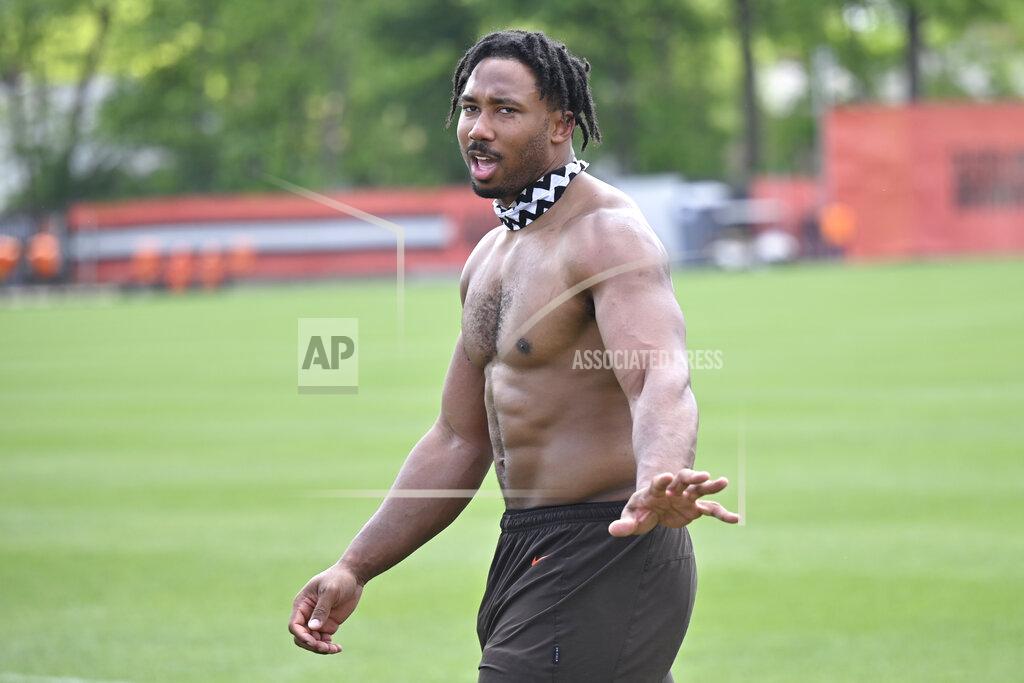 David Richard Cleveland Browns defensive end Myles Garrett walks on the field after an NFL football practice at the team's training facility, Wednesday, June 1, 2022, in Berea, Ohio. (AP Photo/David Richard)