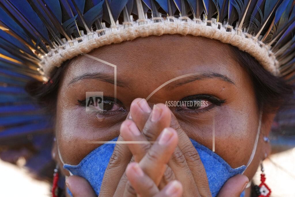 Eraldo Peres An Indigenous woman cries after the Supreme Court judges' decision to suspend the vote that defines the demarcation of Indigenous lands, during a protest in front of the Supreme Court building, in Brasilia, Brazil, Wednesday, Sept. 15, 2021. (AP Photo/Eraldo Peres)