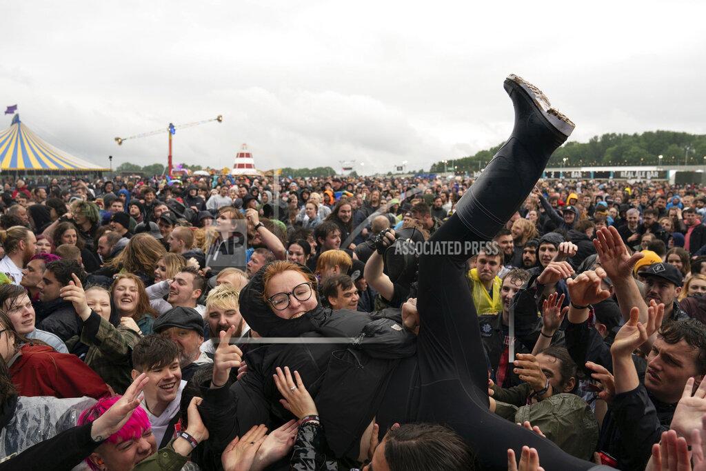 Joe Giddens A festivalgoer crowd surfs on the first day of Download Festival at Donington Park at Castle Donington, England, Friday June 18, 2021. The three-day music and arts festival is being held as a test event to examine how Covid-19 transmission takes place in crowds, with the the capacity significantly reduced from the normal numbers. (Joe Giddens/( /PA via AP)
