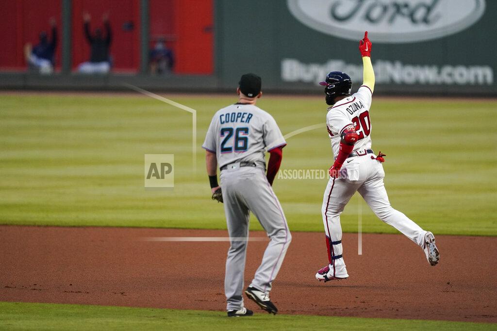 Brynn Anderson Atlanta Braves' Marcell Ozuna (20) celebrates after hitting a solo home run during the first inning of the team's baseball game against the Miami Marlins on Tuesday, Sept. 22, 2020, in Atlanta. (AP Photo/Brynn Anderson)
