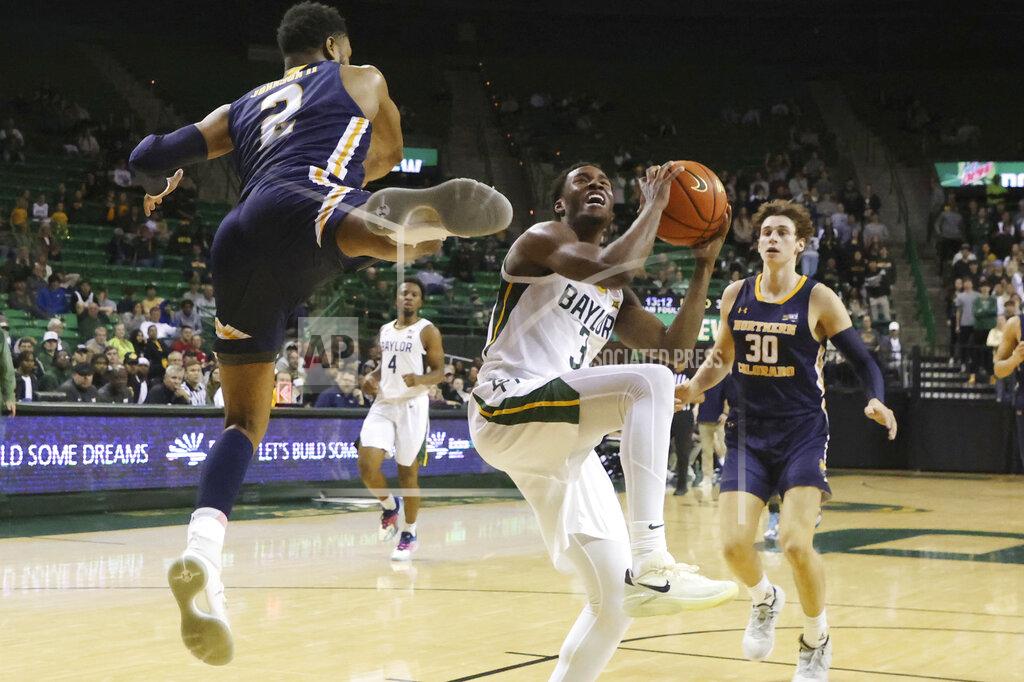 Rod Aydelotte Baylor guard Dale Bonner (3) pulls up while being defended by Northern Colorado guard Matt Johnson II (2) and Caleb Shaw (30) in the second half of an NCAA college basketball game, Monday, Nov. 14, 2022, in Waco, Texas. (AP Photo/Rod Aydelotte(