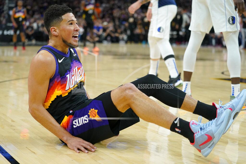 Matt York Phoenix Suns guard Devin Booker (1) looks for a foul call against the Dallas Mavericks during the first half of Game 7 of an NBA basketball Western Conference playoff semifinal, Sunday, May 15, 2022, in Phoenix. (AP Photo/Matt York)