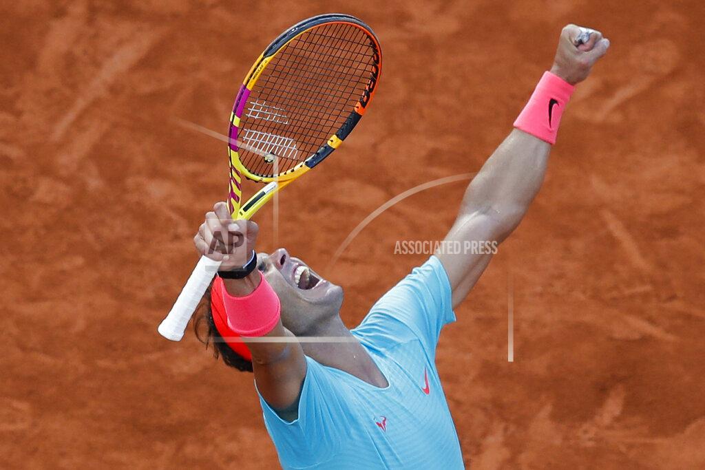 Alessandra Tarantino Spain's Rafael Nadal celebrates winning the semifinal match of the French Open tennis tournament against Argentina's Diego Schwartzman in three sets, 6-3, 6-3, 7-6, at the Roland Garros stadium in Paris, France, Friday, Oct. 9, 2020. (AP Photo/Alessandra Tarantino)