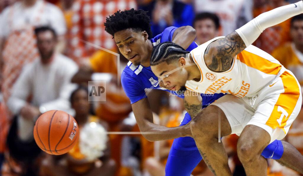 Wade Payne Tennessee guard Lamonte Turner (1) battles for the loose ball with Memphis guard Jayden Hardaway (25) during the first half of an NCAA college basketball game Saturday, Dec. 14, 2019, in Knoxville, Tenn. (AP Photo/Wade Payne)