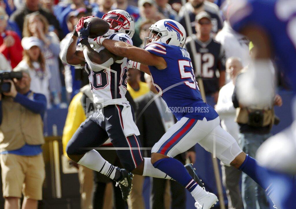 Ron Schwane New England Patriots running back James White, left, catches a pass in front of Buffalo Bills outside linebacker Matt Milano in the first half of an NFL football game, Sunday, Sept. 29, 2019, in Orchard Park, N.Y. (AP Photo/Ron Schwane)