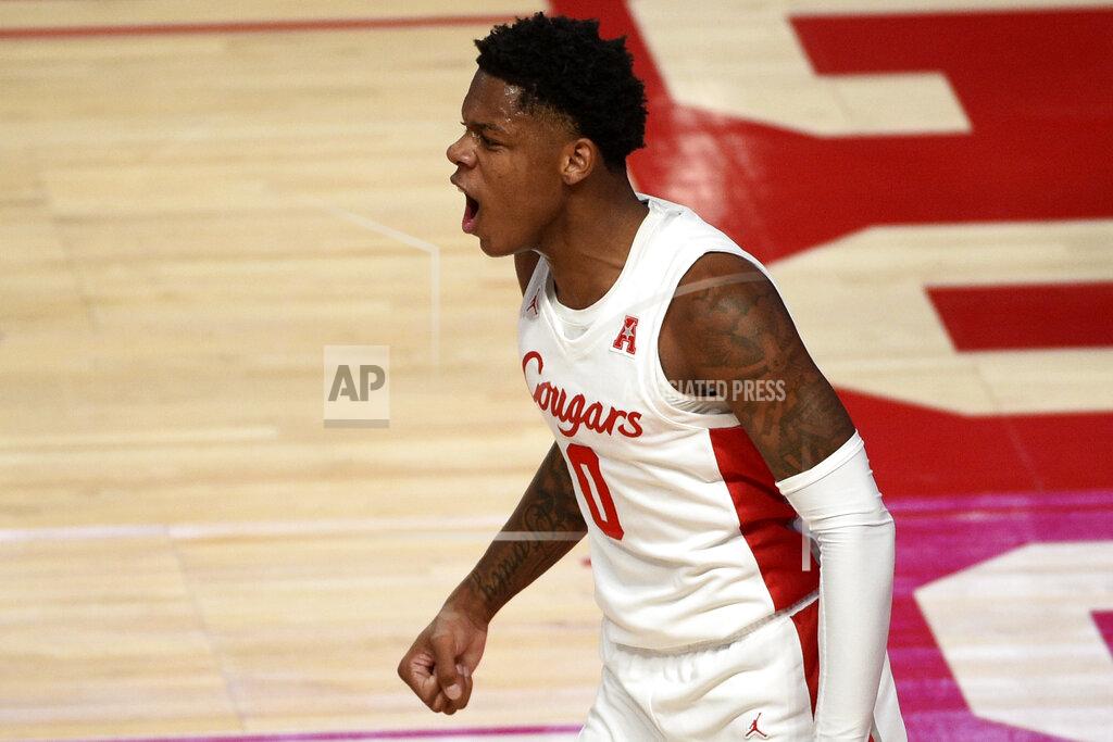 Eric Christian Smith Houston guard Marcus Sasser (0) reacts after drawing a foul during the first half of an NCAA college basketball game against Tulane, Saturday, Jan. 9, 2021, in Houston. (AP Photo/Eric Christian Smith)