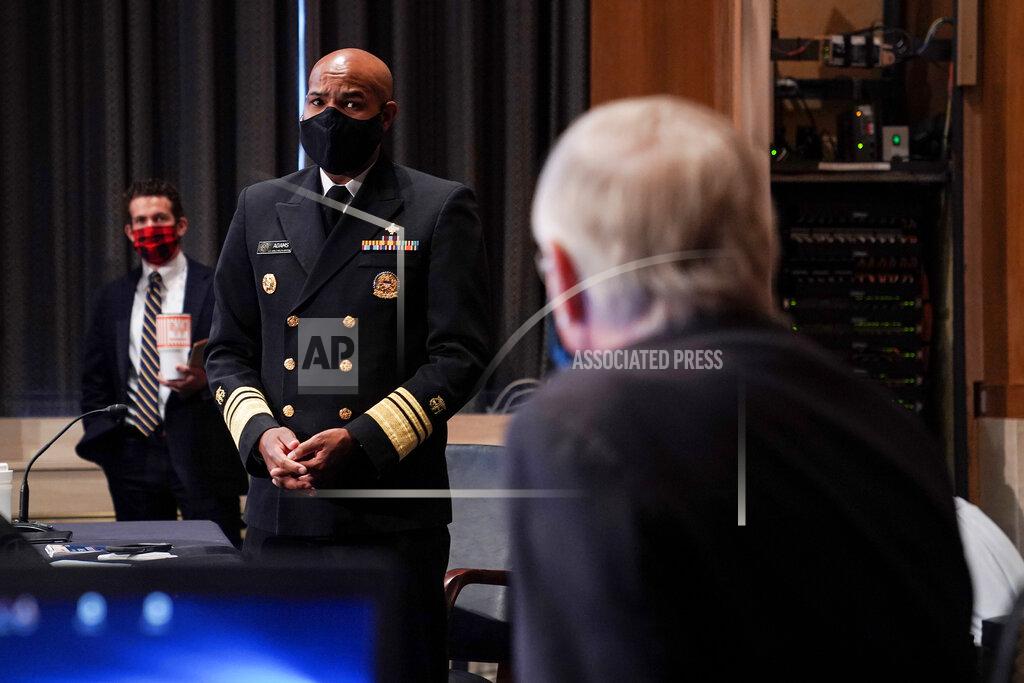 Greg Nash Surgeon General Jerome Adams speaks to Dr. Francis Collins, Director of the National Institutes of Health, as they arrive for a Senate Health, Education, Labor and Pensions Committee hearing to discuss vaccines and protecting public health during the coronavirus pandemic on Capitol Hill, Wednesday, Sept. 9, 2020, in Washington. (Greg Nash/Pool via AP)