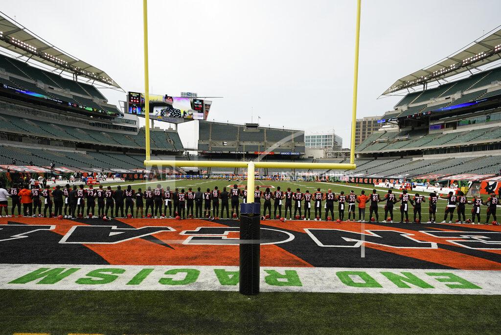 Aaron Doster The Cincinnati Bengals stand arm in arm as "Lift Every Voice and Sing" is played before an NFL football game between the Cincinnati Bengals and the Los Angeles Chargers, Sunday, Sept. 13, 2020, in Cincinnati. (AP Photo/Aaron Doster)