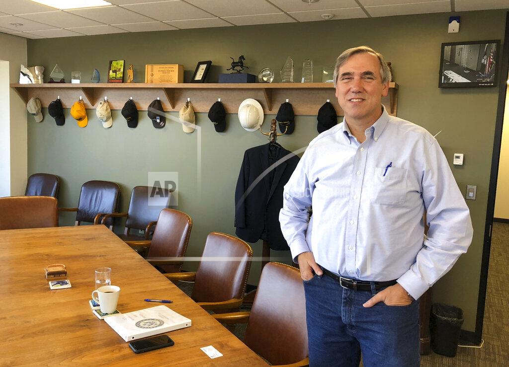 Andrew Selsky FILE - In this Sept. 7, 2018 file photo Sen Jeff Merkley, D-Ore., poses for a photo in his office in Portland, Ore. Merkley faces Republican Jo Rae Perkins in Tuesday's election. (AP Photo/Andrew Selskey,File)