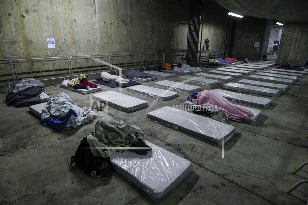 Marcelo Chello Homeless people sleep on mattresses laid out by the government inside a subway station amid historically cold weather in Sao Paulo, Brazil, early Friday, July 30, 2021. The Brazilian government's meteorological institute says low temperatures should endure until the start of August. (AP Photo/Marcelo Chello)