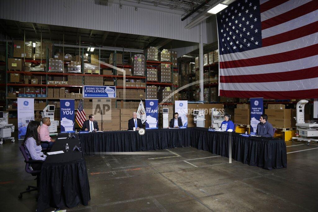 Morry Gash Vice President Mike Pence, center, visits the GE Healthcare manufacturing facility Tuesday April 21, 2020, in Madison, Wis. (AP Photo/Morry Gash)